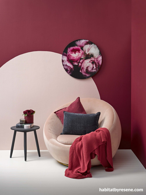 living room, red feature wall, painted circle, pink chair, pink and red, painted feature wall